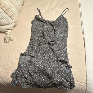 Mini dress with sweet adjustable ruching.